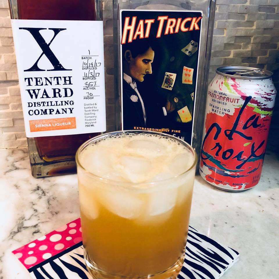 cocktail with tenth ward sienna liqueur, high wire hat trick gin and la croix passionfruit water by frederick md chef chris spear