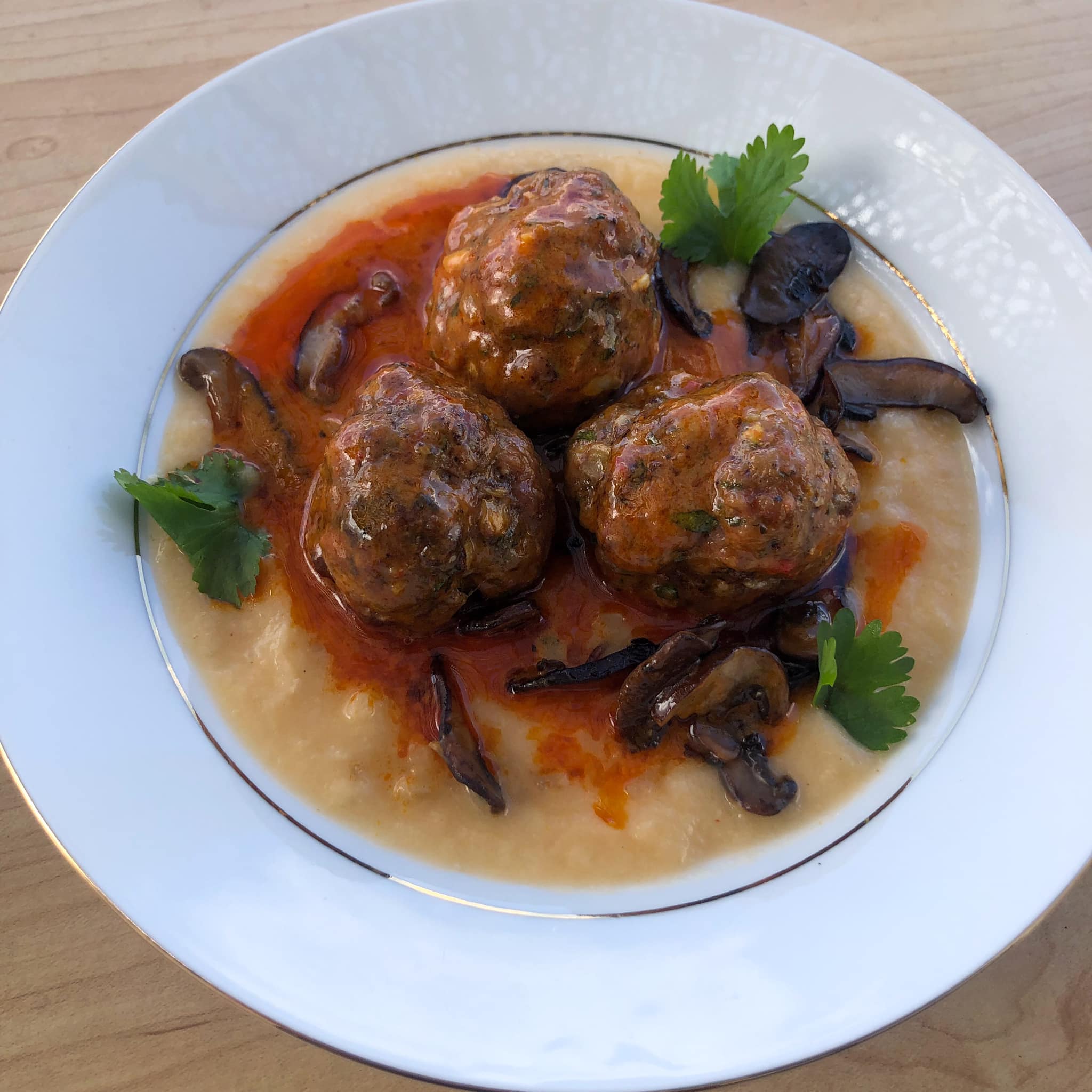 Coconut Harissa Meatballs (Beef/Pork/Veal) with Cauliflower Congee and Shiitake/Criminis Cooked in Bacon Fat with Spiceology Candied Bacon Sriracha Spice